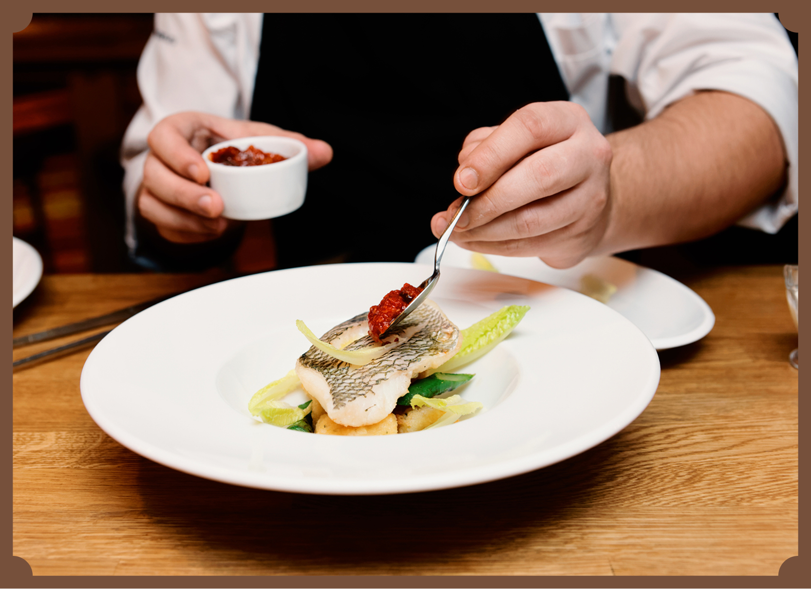 Chef preparing gourmet meal in professional kitchen